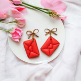 Mini gold bow, red envelope dangle earrings