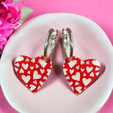 Red background white heart silver hoop earrings